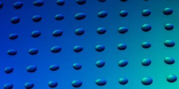 Gotas de agua y aceite sobre superficie que representa la tecnología de separación desarrollada en China.