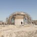 Vivienda autosustentable tipo Earthship construida con materiales reciclados.